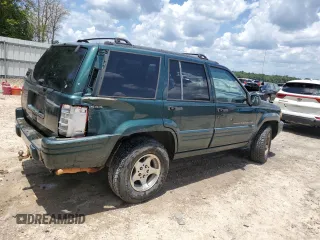 1998 Jeep Grand Cherokee Laredo with VIN 1J4GZ48S5WC289251, listed as a Copart auction lot 63594685 with 156,358 mi miles and Salvage title. Bid and sale history available at DreamBid. Image 3.