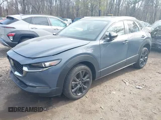 2023 Mazda CX-30 S Carbon Edition with VIN 3MVDMBCM8PM502891, listed as a IAAI auction lot 42050533 with 20,035 mi miles and . Bid and sale history available at DreamBid. Image 2.