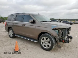 2018 Ford Expedition XLT with VIN 1FMJU1HT8JEA70326, listed as a Copart auction lot 57042785 with 123,249 mi miles and Salvage title. Bid and sale history available at DreamBid. Image 4.