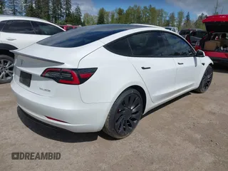 2021 Tesla Model 3 Performance with VIN 5YJ3E1EC2MF096681, listed as a IAAI auction lot 42068782 with 34,852 mi miles and . Bid and sale history available at DreamBid. Image 4.
