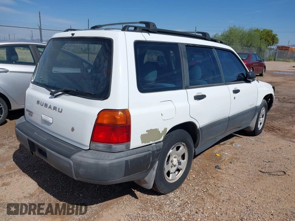 1999 Subaru Forester L with VIN JF1SF6353XH741228, listed as a IAAI auction lot 39377894 with 156,243 mi miles. Bid and sale history available at carsss.com. Image 4.
