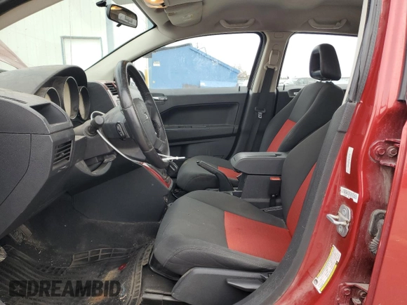 2009 Dodge Caliber SXT with VIN 1B3HB48CX9D108152, listed as a Copart auction lot 81012064 with 189,650 mi miles and Salvage Title. Bid and sale history available at DreamBid. Image 7.