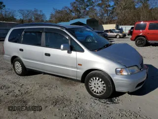 1997 Honda Odyssey with VIN RA11239041, listed as a Copart auction lot 85819024 with 79,952 mi miles and Salvage title. Bid and sale history available at DreamBid. Image 4.