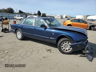 2000 Jaguar XJ with VIN SAJDA14C7YLF18873, listed as a Copart auction lot 50032495 with Not Provided miles and Salvage Title. Bid and sale history available at DreamBid. Image 4.