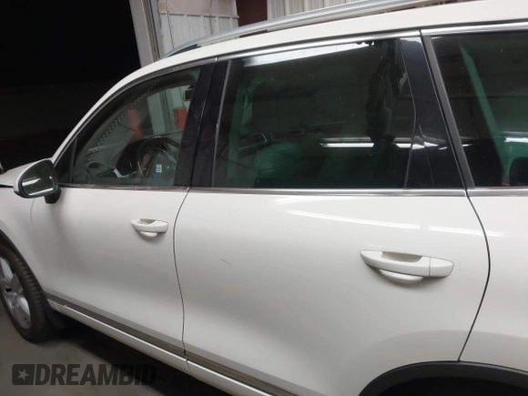 2012 Volkswagen Touareg Sport with VIN WVGFK9BP2CD002991, listed as a IAAI auction lot 42077523 with 94,515 mi miles and . Bid and sale history available at DreamBid. Image 14.
