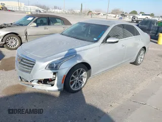 2019 Cadillac CTS Luxury RWD with VIN 1G6AR5SX7K0110826, listed as a IAAI auction lot 41596118 with 58,387 mi miles and . Bid and sale history available at DreamBid. Image 2.