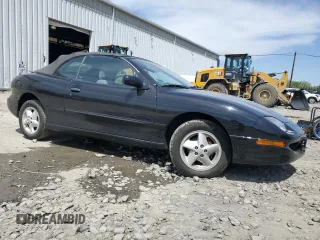 1998 Pontiac Sunfire z VIN 4G2JB32T1WB201350, wystawiony jako Copart lot #53074805 z przebiegiem 128 486 mil mil oraz Szkody całkowita. Historia ofert i sprzedaży dostępna na DreamBid. Obrazek 4.