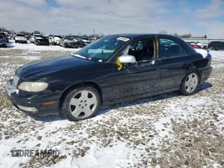 2000 Cadillac Catera z VIN W06VR54R6YR115972, wystawiony jako Copart lot #46255395 z przebiegiem 186 416 mil mil oraz Tytuł czysty. Historia ofert i sprzedaży dostępna na DreamBid. Obrazek 1.