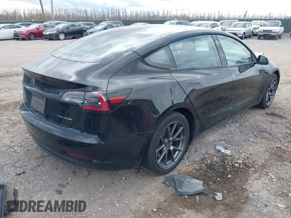 2021 Tesla Model 3 Long Range with VIN 5YJ3E1EB4MF012822, listed as a IAAI auction lot 41918721 with 69,105 mi miles. Bid and sale history available at carsss.com. Image 4.