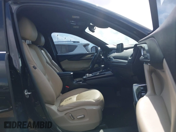 2017 Mazda CX-9 Grand Touring with VIN JM3TCADY5H0129798, listed as a IAAI auction lot 42079754 with 128,403 mi miles and . Bid and sale history available at DreamBid. Image 5.