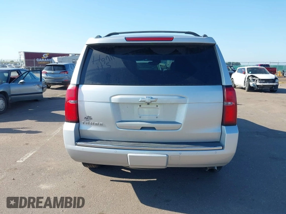 2015 Chevrolet Tahoe LTZ with VIN 1GNSKCKC5FR205739, listed as a IAAI auction lot 40020644 with 142,524 mi miles and . Bid and sale history available at DreamBid. Image 16.