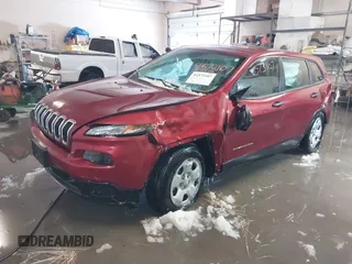 2014 Jeep Cherokee Sport with VIN 1C4PJMABXEW125420, listed as a IAAI auction lot 41573107 with 125,546 mi miles. Bid and sale history available at carsss.com. Image 2.