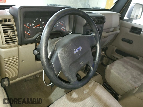 2005 Jeep Wrangler Sport z VIN 1J4FA49S75P325028, wystawiony jako Copart lot #56942315 z przebiegiem 169 988 mil mil oraz Szkoda całkowita • Salvage title. Historia ofert i sprzedaży dostępna na DreamBid. Obrazek 8.