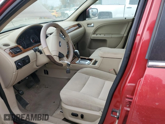 2005 Ford Five Hundred SEL with VIN 1FAFP24175G143889, listed as a Copart auction lot 77216384 with 0 mi miles and Salvage Title. Bid and sale history available at carsss.com. Image 7.