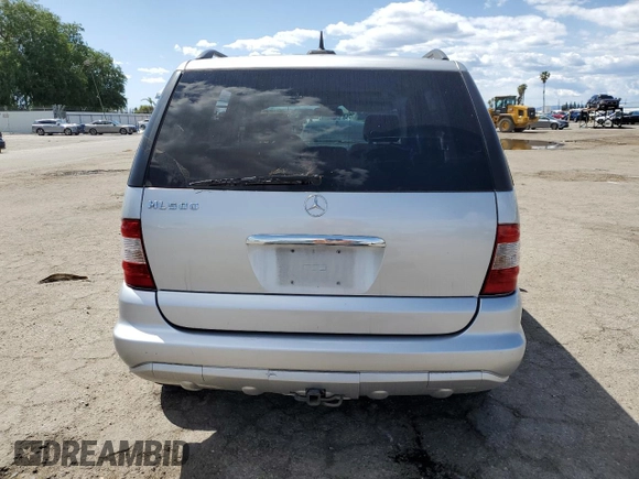2004 Mercedes-Benz M-Class with VIN 4JGAB75EX4A470494, listed as a Copart auction lot 52024515 with 185,639 mi miles and Salvage Title. Bid and sale history available at carsss.com. Image 6.