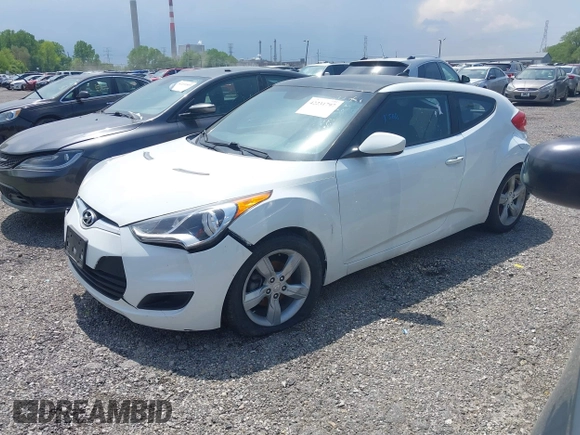 2015 Hyundai Veloster z VIN KMHTC6AD8FU228494, wystawiony jako IAAI lot #42231797 z przebiegiem 111 141 mil mil oraz . Historia ofert i sprzedaży dostępna na DreamBid. Obrazek 2.
