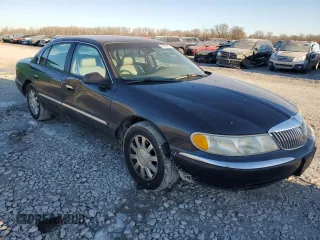 1999 Lincoln Continental with VIN 1LNHM97V2XY719495, listed as a Copart auction lot 42239665 with 234,544 mi miles and Salvage Title. Bid and sale history available at carsss.com. Image 4.