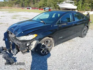 2018 Ford Fusion SE with VIN 3FA6P0LU7JR138906, listed as a IAAI auction lot 41573985 with 127,660 mi miles and . Bid and sale history available at DreamBid. Image 2.