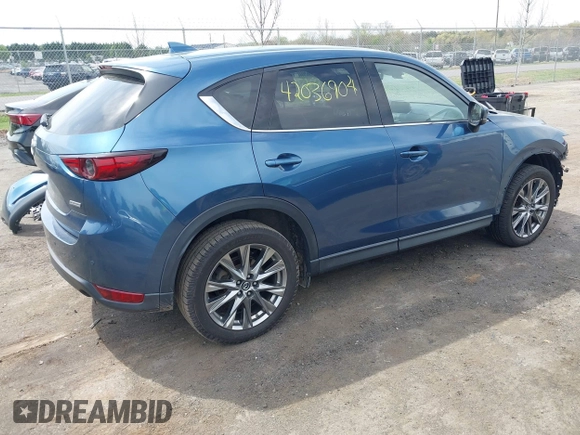 2019 Mazda CX-5 Signature with VIN JM3KFBEY1K0512880, listed as a IAAI auction lot 42036904 with 92,650 mi miles. Bid and sale history available at carsss.com. Image 4.