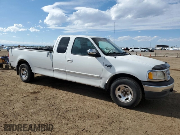 1999 Ford F-150 with VIN 2FTRX17L0XCA37979, listed as a Copart auction lot 58216695 with 256,055 mi miles and Clean title. Bid and sale history available at DreamBid. Image 4.