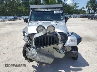2005 Jeep Wrangler Sport z VIN 1J4FA49S75P324462, wystawiony jako Copart lot #59818995 z przebiegiem 183 558 mil mil oraz Nie do naprawy • Non repairable. Historia ofert i sprzedaży dostępna na DreamBid. Obrazek 5.