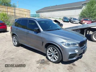 2014 BMW X5 xDrive50i with VIN 5UXKR6C57E0J72301, listed as a IAAI auction lot 39379887 with 117,012 mi miles. Bid and sale history available at carsss.com. Image 1.