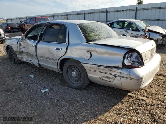 2000 Ford Crown Victoria with VIN 2FAFP73W5YX181565, listed as a Copart auction lot 77098594 with 180,439 mi miles and Salvage Title. Bid and sale history available at carsss.com. Image 2.