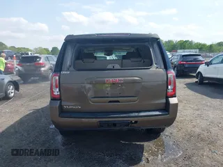 2016 GMC Yukon SLT with VIN 1GKS1BKC9GR328861, listed as a IAAI auction lot 42010839 with 200,711 mi miles. Bid and sale history available at carsss.com. Image 16.