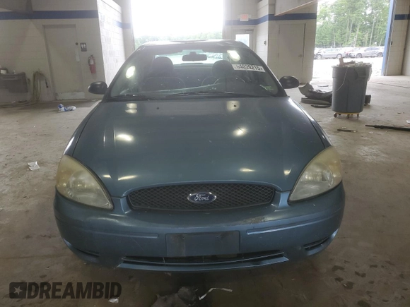 2007 Ford Taurus SE with VIN 1FAFP53U17A215432, listed as a Copart auction lot 64029215 with 121,190 mi miles and Salvage title. Bid and sale history available at DreamBid. Image 5.