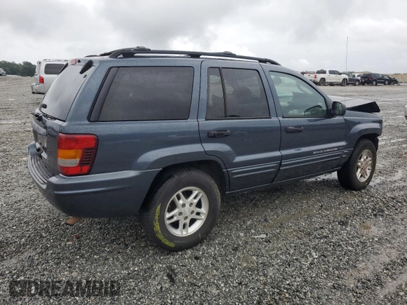 2004 Jeep Grand Cherokee Laredo with VIN 1J4GX48SX4C201569, listed as a Copart auction lot 58631585 with 271,124 mi miles and Salvage title. Bid and sale history available at DreamBid. Image 3.