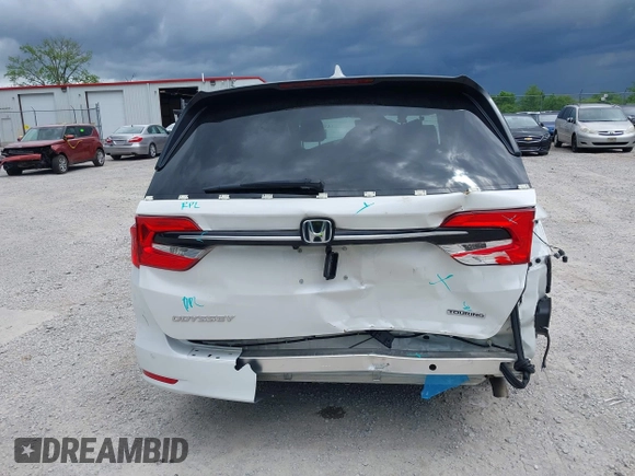 2023 Honda Odyssey Touring with VIN 5FNRL6H88PB079716, listed as a IAAI auction lot 42208628 with 26,679 mi miles and . Bid and sale history available at DreamBid. Image 6.