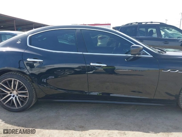 2015 Maserati Ghibli with VIN ZAM57XSA9F1146055, listed as a IAAI auction lot 41814633 with 88,783 mi miles. Bid and sale history available at carsss.com. Image 14.