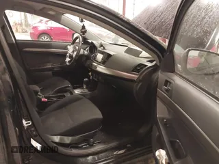 2015 Mitsubishi Lancer SE with VIN JA32V2FW6FU019508, listed as a IAAI auction lot 41633196 with 91,758 mi miles. Bid and sale history available at carsss.com. Image 5.