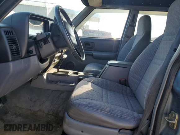 1998 Jeep Cherokee Sport with VIN 1J4FT68S0WL138603, listed as a Copart auction lot 86766454 with 0 mi miles and Salvage Title. Bid and sale history available at carsss.com. Image 7.