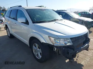 2012 Dodge Journey SXT z VIN 3C4PDCBG7CT374496, wystawiony jako IAAI lot #42317000 z przebiegiem 149 029 mil mil oraz . Historia ofert i sprzedaży dostępna na DreamBid. Obrazek 1.