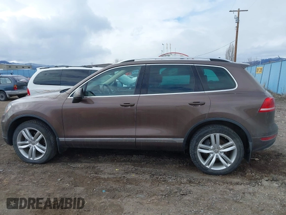 2013 Volkswagen Touareg Lux with VIN WVGEF9BP1DD012851, listed as a IAAI auction lot 41732391 with 123,283 mi miles and . Bid and sale history available at DreamBid. Image 15.