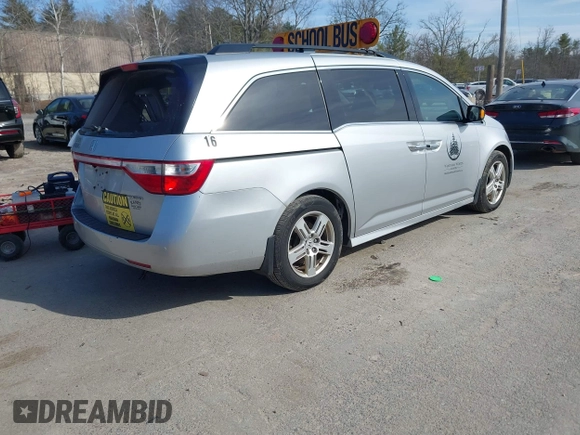 2012 Honda Odyssey Touring with VIN 5FNRL5H95CB063003, listed as a IAAI auction lot 41871975 with 179,332 mi miles and . Bid and sale history available at DreamBid. Image 4.