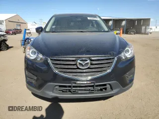 2016 Mazda CX-5 Sport with VIN JM3KE4BY4G0734582, listed as a Copart auction lot 55908515 with 52,323 mi miles and Salvage title. Bid and sale history available at DreamBid. Image 5.