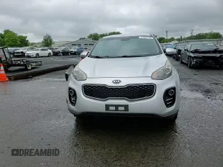 2017 Kia Sportage LX z VIN KNDPMCAC4H7036399, wystawiony jako Copart lot #57631155 z przebiegiem 89 803 mil mil oraz Szkoda całkowita • Salvage title. Historia ofert i sprzedaży dostępna na DreamBid. Obrazek 13.