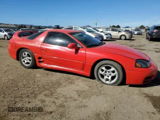 1999 Mitsubishi 3000GT z VIN JA3AM44H2XY001614, wystawiony jako Copart lot #77580444 z przebiegiem 128 948 mil mil oraz Tytuł czysty. Historia ofert i sprzedaży dostępna na DreamBid. Obrazek 4.