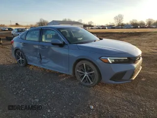 2022 Honda Civic Touring z VIN 2HGFE1F90NH324934, wystawiony jako Copart lot #48501555 z przebiegiem 99 825 mil mil oraz Szkoda całkowita • Salvage title. Historia ofert i sprzedaży dostępna na DreamBid. Obrazek 4.
