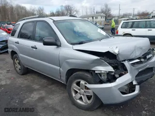 2009 Kia Sportage LX with VIN KNDJE723697622175, listed as a IAAI auction lot 41988461 with 165,014 mi miles. Bid and sale history available at carsss.com. Image 1.