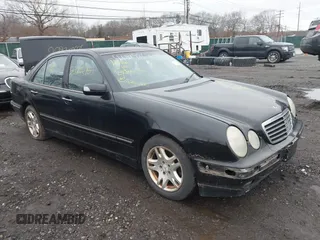 2002 Mercedes-Benz E-Class with VIN WDBJF82J52X064244, listed as a IAAI auction lot 41819863 with 999,999 mi miles. Bid and sale history available at carsss.com. Image 1.