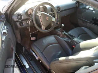 2006 Porsche Cayman S с VIN WP0AB298X6U784188, выставлен на аукционе Copart как лот 77872504 с пробегом Не указан миль и Списание • Salvage title. История ставок и продаж доступна на DreamBid. Изображение 8.