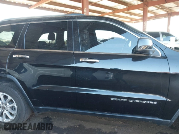 2014 Jeep Grand Cherokee Laredo with VIN 1C4RJEAG3EC472714, listed as a IAAI auction lot 40980100 with 124,603 mi miles. Bid and sale history available at carsss.com. Image 14.
