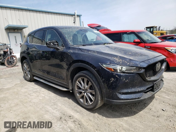 2020 Mazda CX-5 Grand Touring with VIN JM3KFBDM0L0767634, listed as a Copart auction lot 54433935 with 57,901 mi miles and Salvage Title. Bid and sale history available at carsss.com. Image 4.