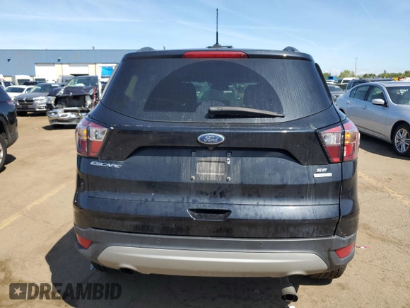 2017 Ford Escape SE z VIN 1FMCU0GD5HUD52467, wystawiony jako Copart lot #70616944 z przebiegiem 115 876 mil mil oraz Szkoda całkowita • Salvage title. Historia ofert i sprzedaży dostępna na DreamBid. Obrazek 6.