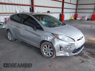 2013 Ford Fiesta SE with VIN 3FADP4EJ2DM173842, listed as a IAAI auction lot 42048262 with 82,637 mi miles. Bid and sale history available at carsss.com. Image 1.