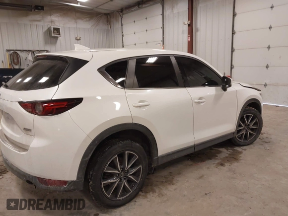 2018 Mazda CX-5 S Premium with VIN JM3KFBDM1J1412088, listed as a IAAI auction lot 41497431 with 65,532 mi miles and . Bid and sale history available at DreamBid. Image 4.