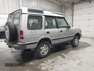 1996 Land Rover Discovery z VIN SALJY1282TA192177, wystawiony jako IAAI lot #42221390 z przebiegiem 167 727 mil mil oraz . Historia ofert i sprzedaży dostępna na DreamBid. Obrazek 4.